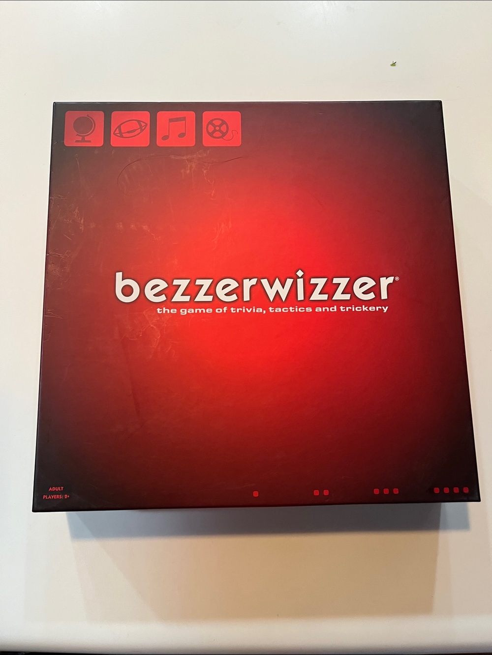 Bezzerwizzer Trivia Board Game - Red Game Box